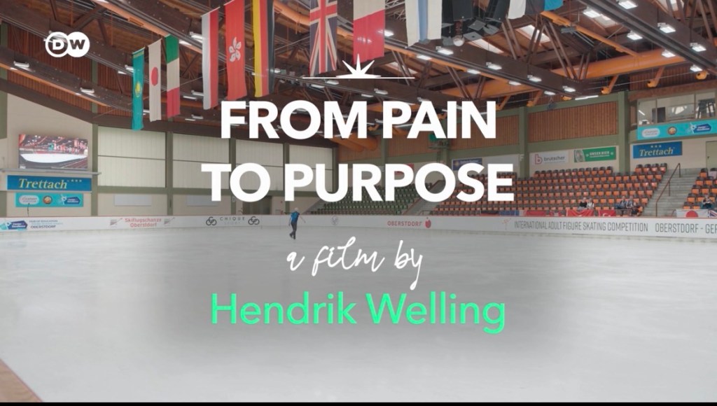 An ice skating rink with flags from various countries hanging overhead, featuring the text 'FROM PAIN TO PURPOSE' and a credit to filmmaker Hendrik Welling.